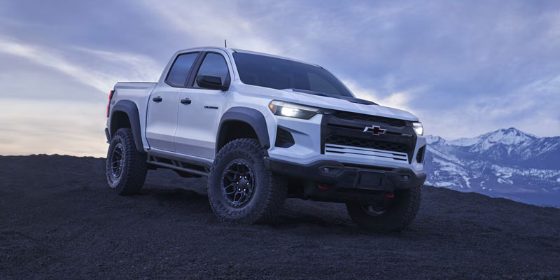 White Chevrolet Colorado off-road mountain truck

